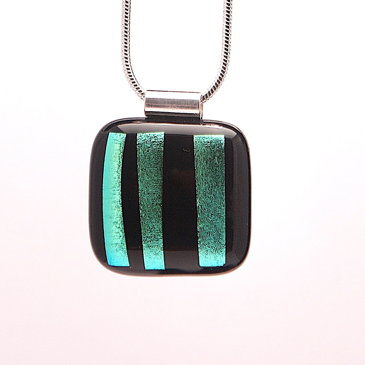 Black glass pendant with gold stripes